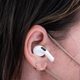 A photo of the AirPods Pro in a person's ear